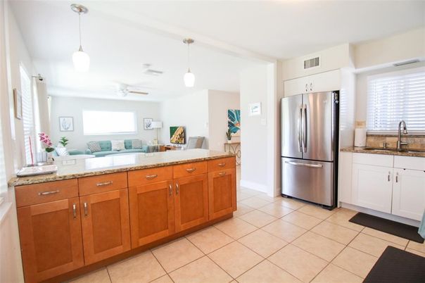Interior, Kitchen, Stainless Steel Appliances, Tile Countertops, Ceramic Tile, Pendant Lights