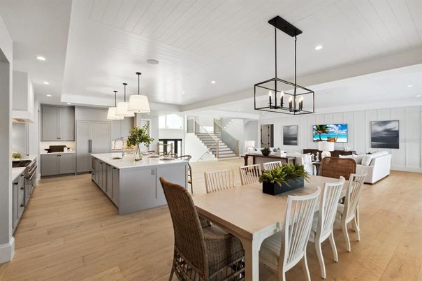 Chandelier, Dining room, Interior, Kitchen, Living room, Pendant Lights, Recessed Lighting, Stainless Steel Appliances, Wood Texture Flooring