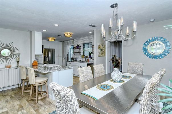 Chandelier, Dining room, Interior, Kitchen, Recessed Lighting, Stainless Steel Appliances, Wood Texture Flooring