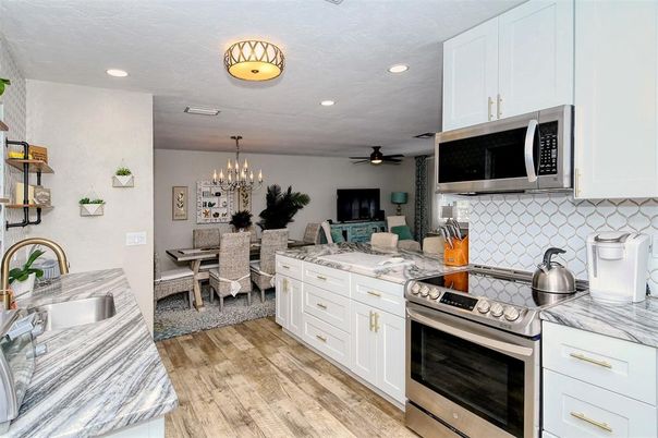 Chandelier, Dining room, Interior, Kitchen, Recessed Lighting, Stainless Steel Appliances, Wood Texture Flooring