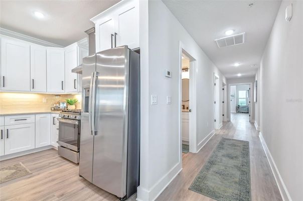 Interior, Kitchen, Recessed Lighting, Stainless Steel Appliances, Wood Texture Flooring