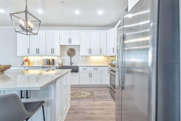 Interior, Kitchen, Pendant Lights, Recessed Lighting, Stainless Steel Appliances, Wood Texture Flooring