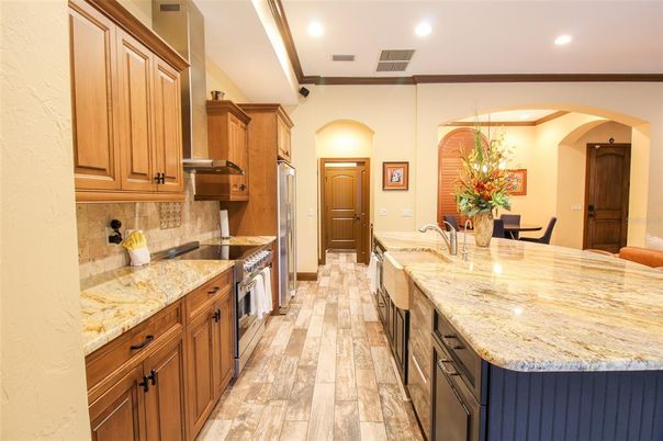 Interior, Kitchen, Wood Texture Flooring, Recessed Lighting, Dining room, Chandelier, Stainless Steel Appliances, Pendant Lights