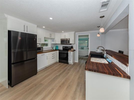 Interior, Kitchen, Pendant Lights, Recessed Lighting, Stainless Steel Appliances, Wood Texture Flooring
