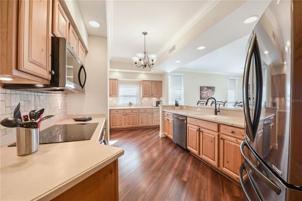 Chandelier, Interior, Kitchen, Recessed Lighting, Stainless Steel Appliances, Wood Texture Flooring