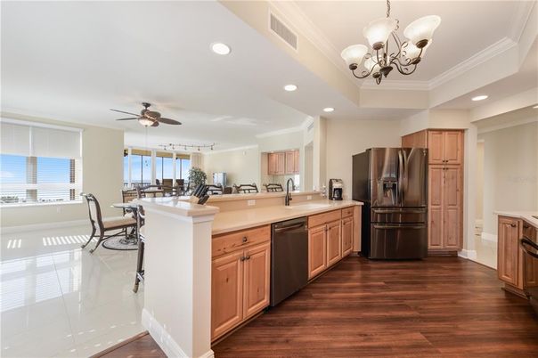 Chandelier, Dining room, Interior, Kitchen, Recessed Lighting, Stainless Steel Appliances, Wood Texture Flooring