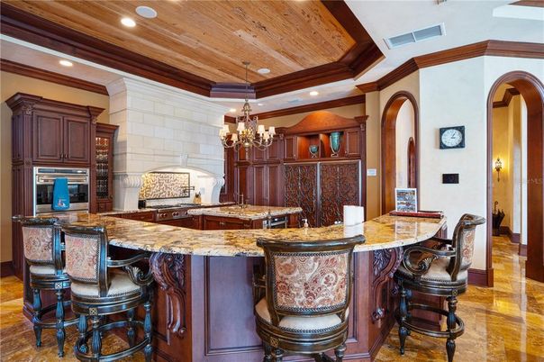 Chandelier, Interior, Kitchen, Recessed Lighting, Stainless Steel Appliances, Stone Walls, Wooden Ceilings