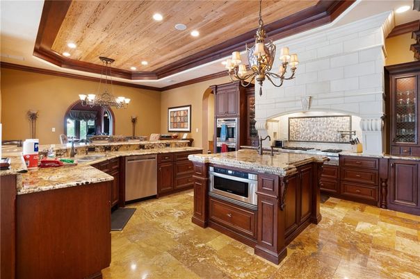 Chandelier, Interior, Kitchen, Recessed Lighting, Stainless Steel Appliances, Stone Walls, Wooden Ceilings