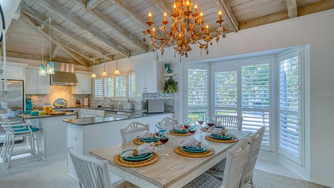 Chandelier, Dining room, Interior, Kitchen, Pendant Lights, Stainless Steel Appliances, Wooden Beams, Wooden Ceilings, Wood Texture Flooring