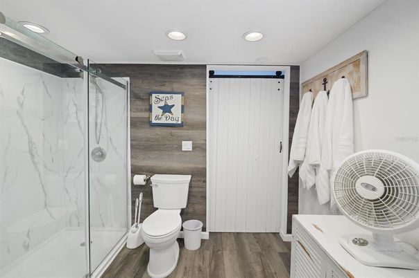 Bathroom, Glass Shower, Interior, Marble Walls, Recessed Lighting, Wood Texture Flooring