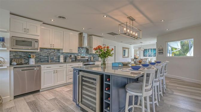 Dining room, Interior, Kitchen, Pendant Lights, Recessed Lighting, Stainless Steel Appliances, Wood Texture Flooring