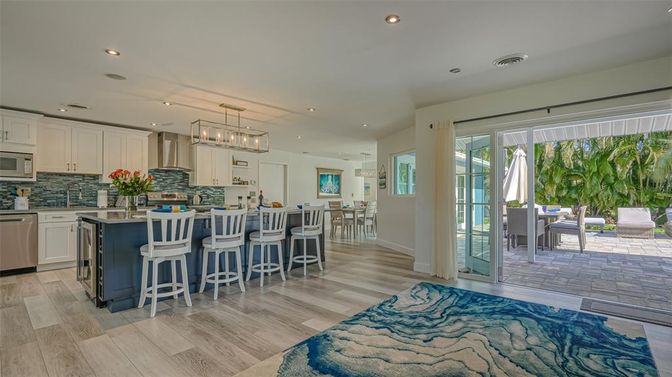 Chandelier, Dining room, Interior, Kitchen, Pendant Lights, Recessed Lighting, Stainless Steel Appliances, Wood Texture Flooring
