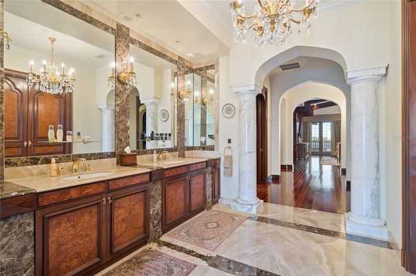 Bathroom, Chandelier, Dual Sink Vanities, Interior, Wood Texture Flooring