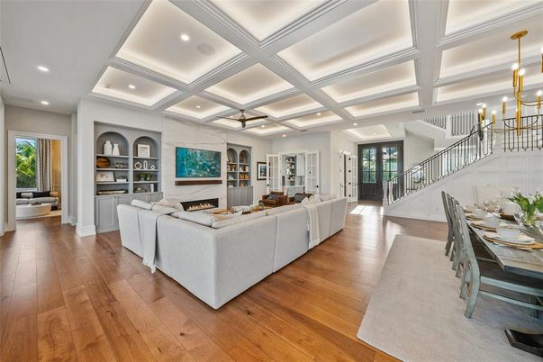 Dining room, Fireplace, Interior, Living room, Pendant Lights, Recessed Lighting, Wood Texture Flooring