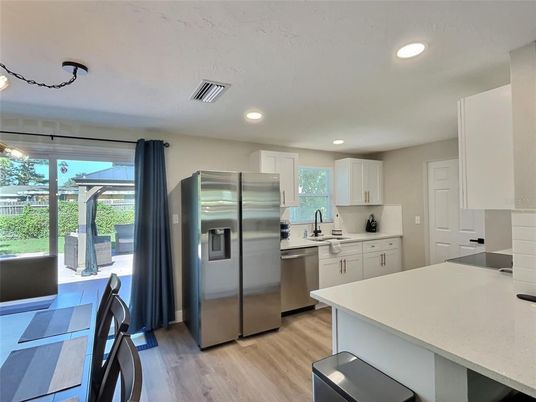 Interior, Kitchen, Recessed Lighting, Stainless Steel Appliances, Wood Texture Flooring