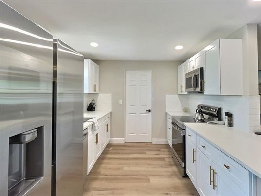Interior, Kitchen, Recessed Lighting, Stainless Steel Appliances, Wood Texture Flooring