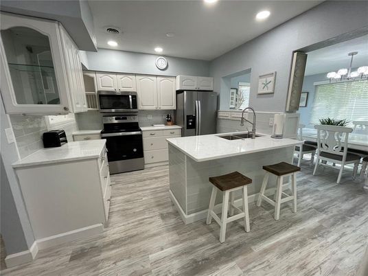 Dining room, Interior, Kitchen, Recessed Lighting, Stainless Steel Appliances, Wood Texture Flooring