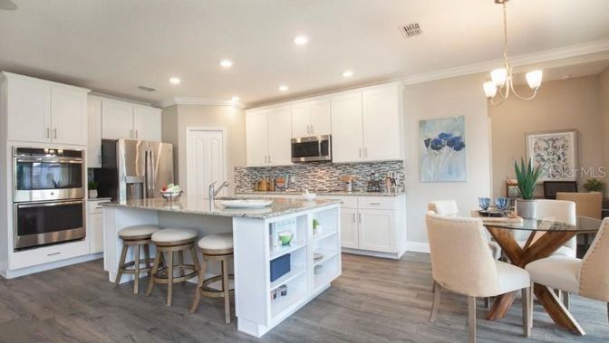 Dining room, Interior, Kitchen, Pendant Lights, Recessed Lighting, Stainless Steel Appliances, Wood Texture Flooring