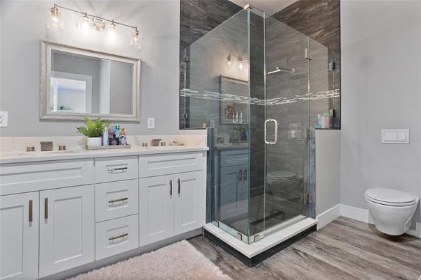 Bathroom, Dual Sink Vanities, Glass Shower, Interior, Wood Texture Flooring