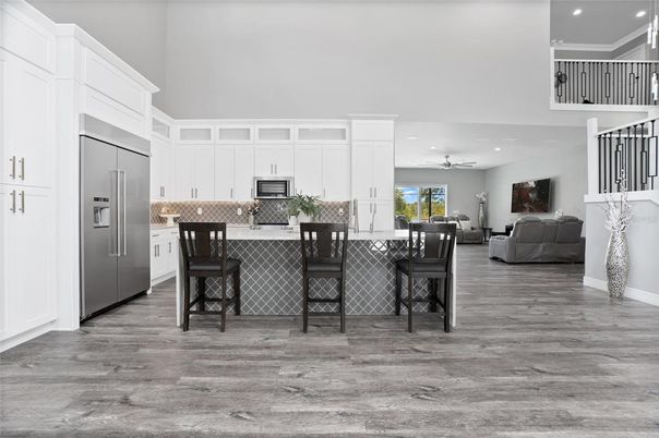 Dining room, Interior, Kitchen, Living room, Recessed Lighting, Stainless Steel Appliances, Wood Texture Flooring