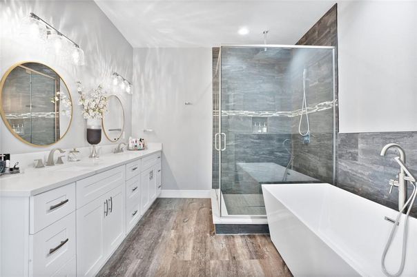 Bathroom, Dual Sink Vanities, Free Standing Baths, Glass Shower, Interior, Recessed Lighting, Wood Texture Flooring
