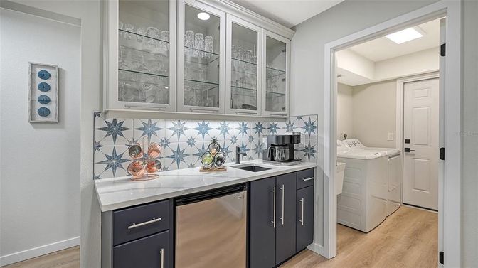 Interior, Kitchen, Recessed Lighting, Washer, Wood Texture Flooring