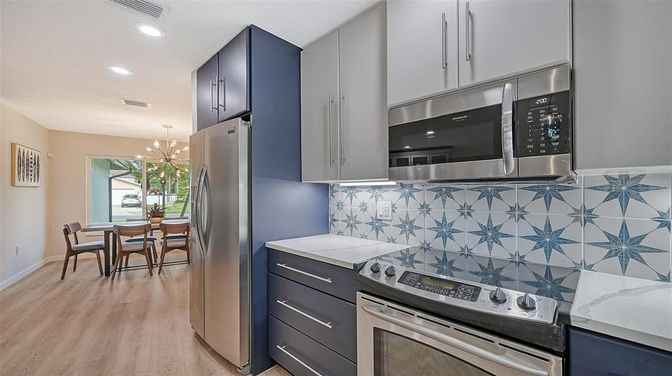 Dining room, Interior, Kitchen, Pendant Lights, Recessed Lighting, Stainless Steel Appliances, Wood Texture Flooring