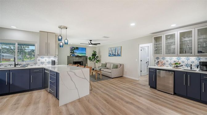 Fireplace, Interior, Kitchen, Living room, Pendant Lights, Recessed Lighting, Stainless Steel Appliances, Wood Texture Flooring