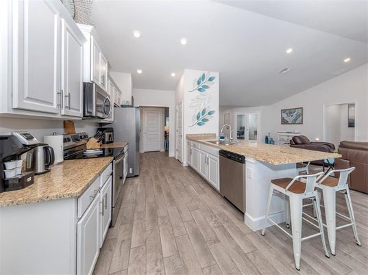 Interior, Kitchen, Recessed Lighting, Stainless Steel Appliances, Wood Texture Flooring