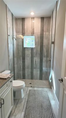 Bathroom, Glass Shower, Interior, Recessed Lighting, Wood Texture Flooring