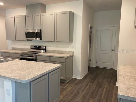 Interior, Kitchen, Recessed Lighting, Stainless Steel Appliances, Wood Texture Flooring
