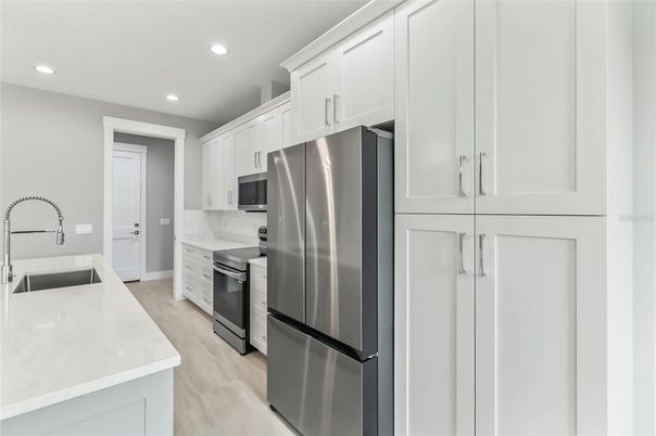 Interior, Kitchen, Recessed Lighting, Stainless Steel Appliances, Wood Texture Flooring