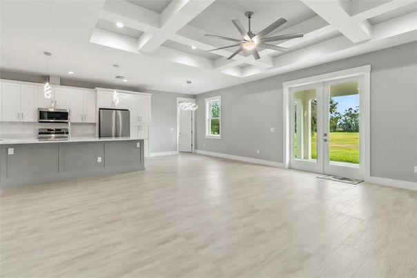 Empty room, Interior, Kitchen, Pendant Lights, Recessed Lighting, Stainless Steel Appliances, Wood Texture Flooring