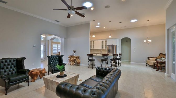 Chandelier, Dining room, Interior, Kitchen, Living room, Pendant Lights, Recessed Lighting, Stainless Steel Appliances, Wood Texture Flooring