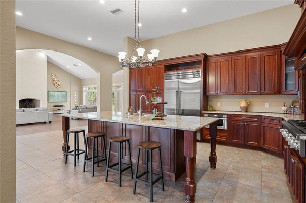 Chandelier, Fireplace, Interior, Kitchen, Recessed Lighting, Stainless Steel Appliances