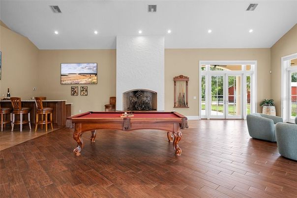 Billiard Table, Fireplace, Game Room, Interior, Recessed Lighting, Wood Texture Flooring
