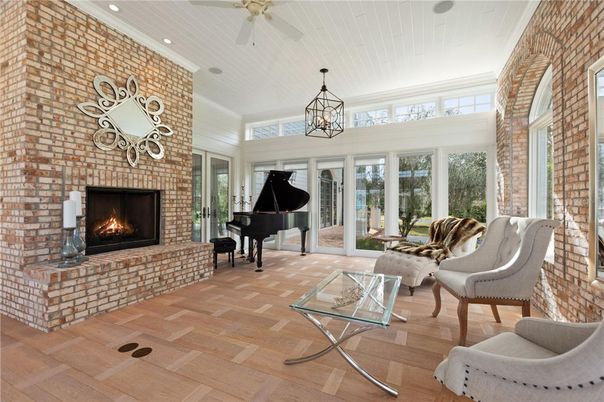 Fireplace, Interior, Living room, Pendant Lights, Piano, Recessed Lighting, Stone Walls, Wood Texture Flooring