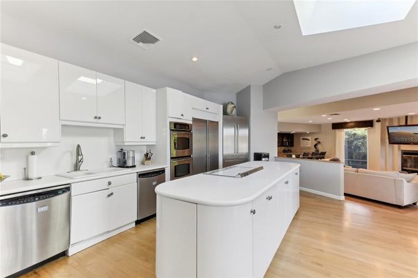 Fireplace, Interior, Kitchen, Living room, Recessed Lighting, Stainless Steel Appliances, Wood Texture Flooring