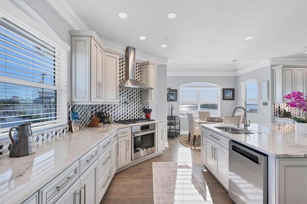 Dining room, Interior, Kitchen, Recessed Lighting, Stainless Steel Appliances, Wood Texture Flooring