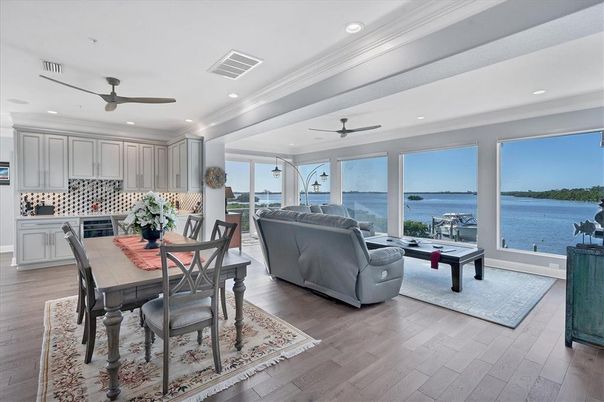 Dining room, Interior, Kitchen, Living room, Recessed Lighting, Water, Wood Texture Flooring