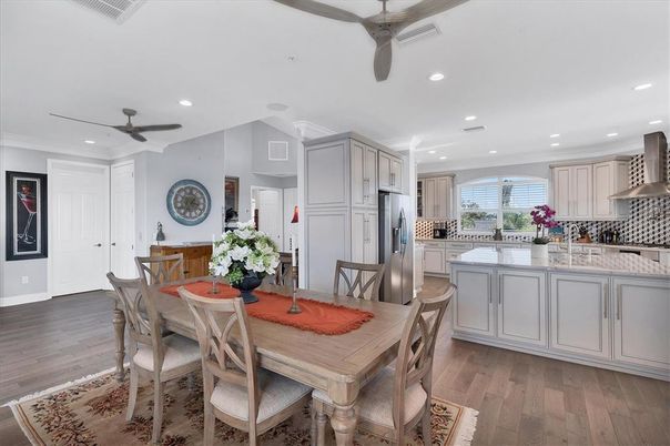 Dining room, Interior, Kitchen, Recessed Lighting, Stainless Steel Appliances, Wood Texture Flooring