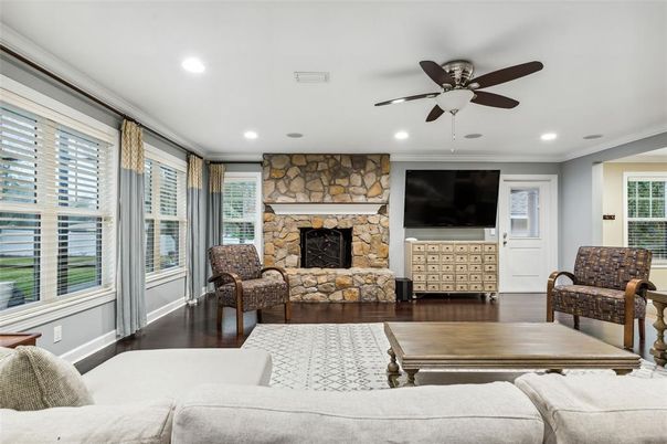 Fireplace, Interior, Living room, Recessed Lighting, Stone Walls, Wood Texture Flooring
