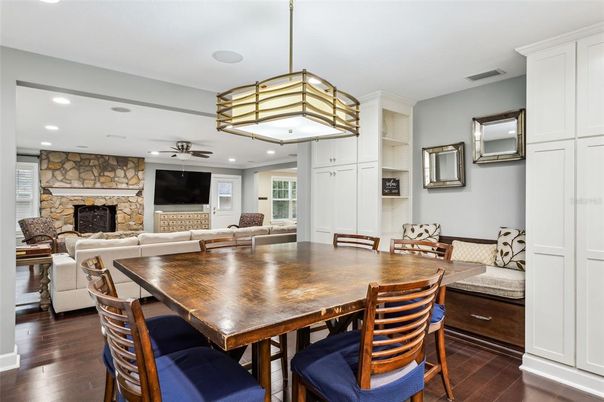 Dining room, Fireplace, Interior, Living room, Pendant Lights, Recessed Lighting, Stone Walls, Wood Texture Flooring