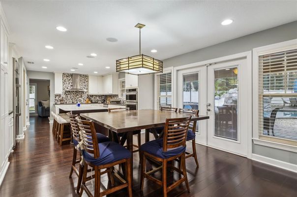 Dining room, Interior, Kitchen, Pendant Lights, Recessed Lighting, Stainless Steel Appliances, Wood Texture Flooring