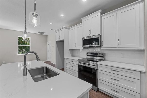 Interior, Kitchen, Pendant Lights, Recessed Lighting, Stainless Steel Appliances, Wood Texture Flooring