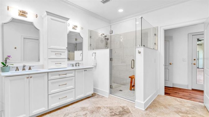 Bathroom, Dual Sink Vanities, Glass Shower, Interior, Recessed Lighting, Wood Texture Flooring