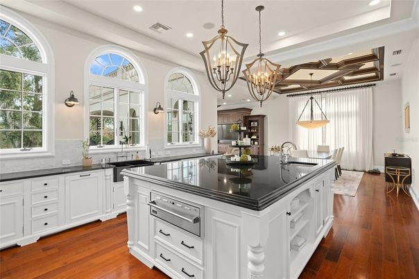 Chandelier, Interior, Kitchen, Pendant Lights, Recessed Lighting, Stainless Steel Appliances, Wood Texture Flooring