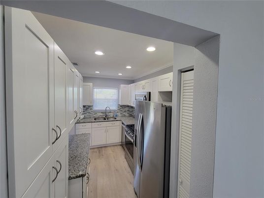 Interior, Kitchen, Recessed Lighting, Stainless Steel Appliances, Wood Texture Flooring