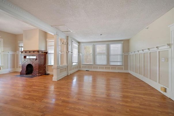 Empty room, Fireplace, Interior, Utility Closets, Washer, Wood Texture Flooring