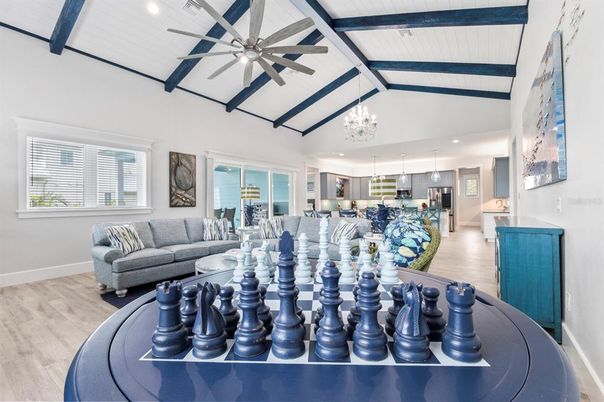 Chandelier, Interior, Kitchen, Living room, Pendant Lights, Recessed Lighting, Stainless Steel Appliances, Wood Texture Flooring